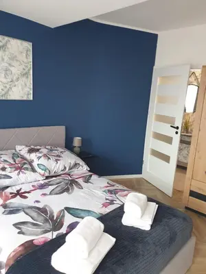 Łóżko lub łóżka w pokoju w obiekcie Modern Apartment