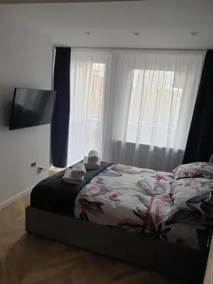 Łóżko lub łóżka w pokoju w obiekcie Modern Apartment