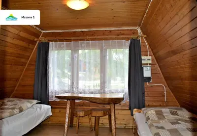 Łóżko lub łóżka w pokoju w obiekcie SuliCamp Kompleks Wypoczynkowy