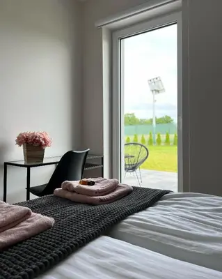 Łóżko lub łóżka w pokoju w obiekcie Domy na polanie-Szafirek