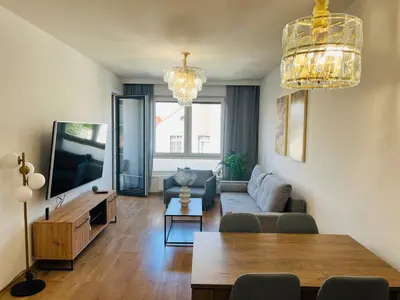 Telewizja i/lub zestaw kina domowego w obiekcie Złote Apartamenty 58