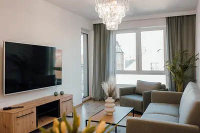 Telewizja i/lub zestaw kina domowego w obiekcie Złote Apartamenty 58