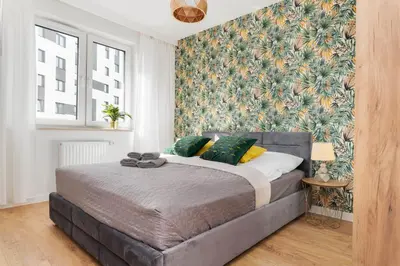Łóżko lub łóżka w pokoju w obiekcie South4You Apartments