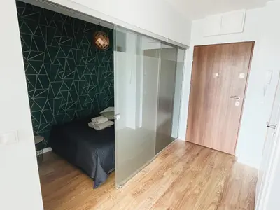 Łóżko lub łóżka w pokoju w obiekcie South4You Apartments