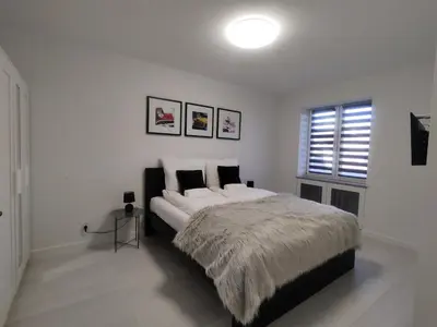 Łóżko lub łóżka w pokoju w obiekcie Apartament Wrocław Borowska