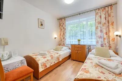 Łóżko lub łóżka w pokoju w obiekcie Pensjonat Miranda