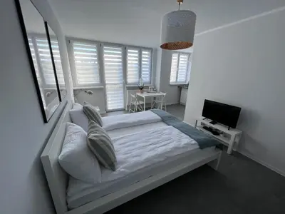 Łóżko lub łóżka w pokoju w obiekcie APARTAMENT OŚ. JASNE 9C