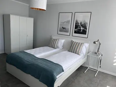 Łóżko lub łóżka w pokoju w obiekcie APARTAMENT OŚ. JASNE 9C