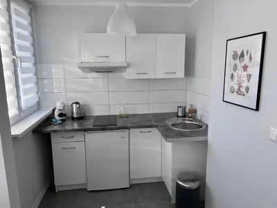 Kuchnia lub aneks kuchenny w obiekcie APARTAMENT OŚ. JASNE 9C