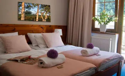 Łóżko lub łóżka w pokoju w obiekcie Hotel Górski Czarna Góra