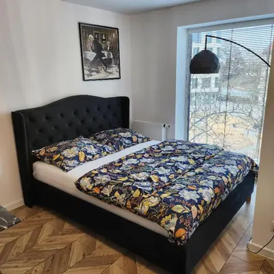 Łóżko lub łóżka w pokoju w obiekcie Morfeusz Apartamenty Księcia Witolda