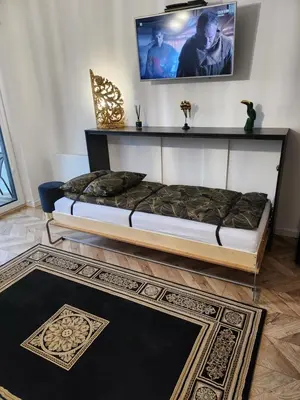 Łóżko lub łóżka w pokoju w obiekcie Morfeusz Apartamenty Księcia Witolda