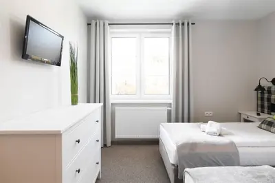 Łóżko lub łóżka w pokoju w obiekcie Róża Sudetów Apartamenty