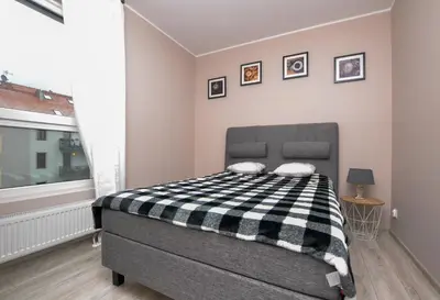 Łóżko lub łóżka w pokoju w obiekcie Apartament DIAMENTOWY z garażem -Centrum Gliwic