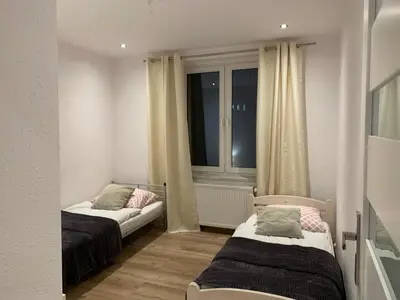Łóżko lub łóżka w pokoju w obiekcie Sweet apartament