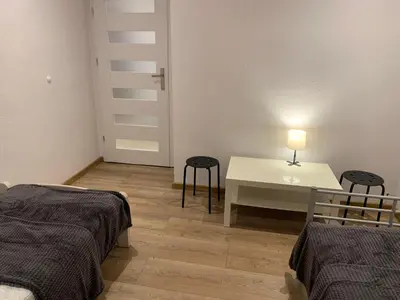 Łóżko lub łóżka w pokoju w obiekcie Sweet apartament