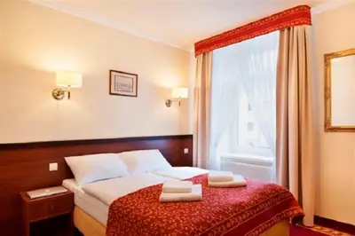 Łóżko lub łóżka w pokoju w obiekcie Resort de Esperanto Sanatorium Uzdrowiskowe