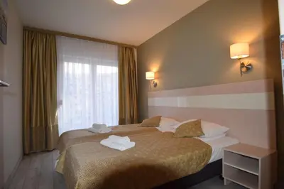 Łóżko lub łóżka w pokoju w obiekcie Apartament Czarna Gora Is6