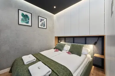 Łóżko lub łóżka w pokoju w obiekcie Lux Apartment Browary Wrocławskie by Noclegi Renters