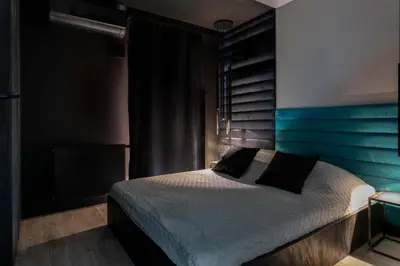 Łóżko lub łóżka w pokoju w obiekcie Niegaleria Apartament