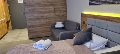 Łóżko lub łóżka w pokoju w obiekcie Aparthotel Apartamenty Czarna Góra 322