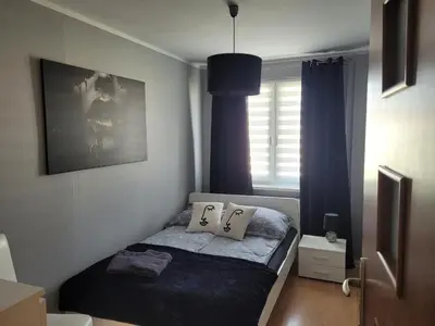 Łóżko lub łóżka w pokoju w obiekcie Apartament Palisadowa