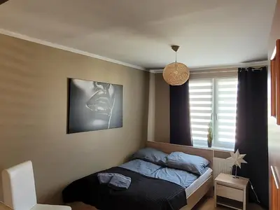 Łóżko lub łóżka w pokoju w obiekcie Apartament Palisadowa