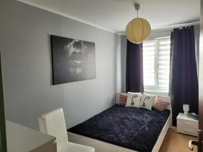Łóżko lub łóżka w pokoju w obiekcie Apartament Palisadowa