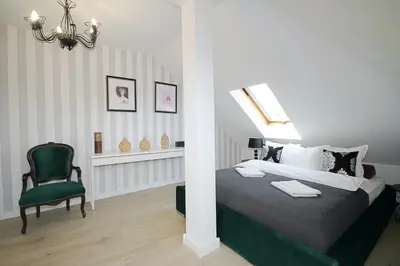 Łóżko lub łóżka w pokoju w obiekcie Apartament Daisy