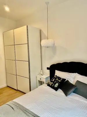 Łóżko lub łóżka w pokoju w obiekcie Jan III Sobieski - Luksusowy apartament L z darmowym prywatnym parkingiem