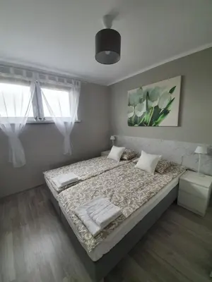 Łóżko lub łóżka w pokoju w obiekcie Siódemka