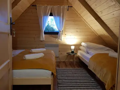 Łóżko lub łóżka w pokoju w obiekcie Chata Rafusa pod Śnieżnikiem