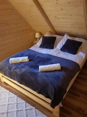 Łóżko lub łóżka w pokoju w obiekcie Chata Rafusa pod Śnieżnikiem