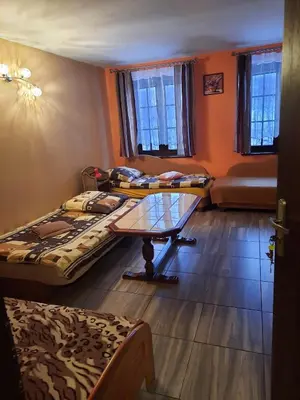 Łóżko lub łóżka w pokoju w obiekcie Agroturystyka Patynówka