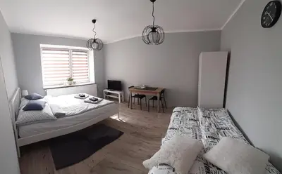 Łóżko lub łóżka w pokoju w obiekcie Apartament Kilińskiego