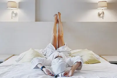 Łóżko lub łóżka w pokoju w obiekcie Holimo Hotel