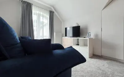 Telewizja i/lub zestaw kina domowego w obiekcie Holimo Hotel