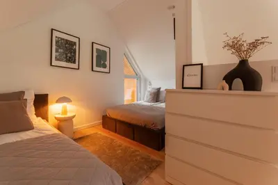 Łóżko lub łóżka w pokoju w obiekcie Hill & Chill Kudowa Zdrój - nowoczesne stodoły ze strefą SPA, balia, sauna