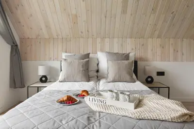 Łóżko lub łóżka w pokoju w obiekcie Hill & Chill Kudowa Zdrój - nowoczesne stodoły ze strefą SPA, balia, sauna