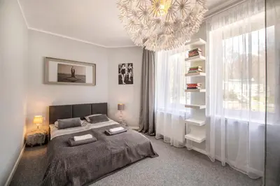 Łóżko lub łóżka w pokoju w obiekcie Apartament Boheme