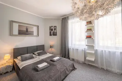 Łóżko lub łóżka w pokoju w obiekcie Apartament Boheme