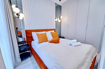 Łóżko lub łóżka w pokoju w obiekcie LAGUNA Apartament Polanica Residence 3