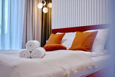Łóżko lub łóżka w pokoju w obiekcie LAGUNA Apartament Polanica Residence 3