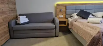 Łóżko lub łóżka w pokoju w obiekcie Aparthotel Apartamenty Czarna Góra 139