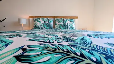 Łóżko lub łóżka w pokoju w obiekcie Słoneczna Przystań - Apartament