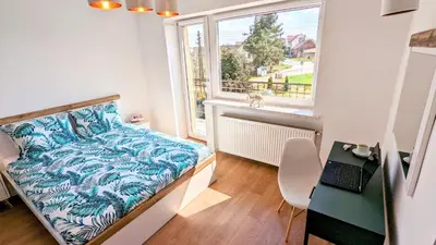 Łóżko lub łóżka w pokoju w obiekcie Słoneczna Przystań - Apartament