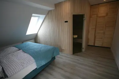 Łóżko lub łóżka w pokoju w obiekcie Leśniczówka Grabczok