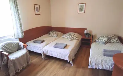 Łóżko lub łóżka w pokoju w obiekcie Chata Zieleniecka