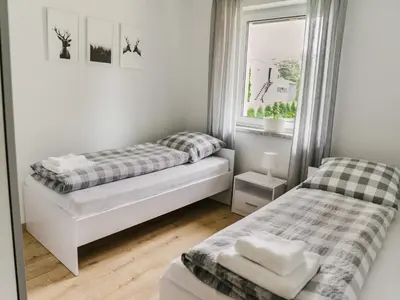 Łóżko lub łóżka w pokoju w obiekcie Domek Moszna
