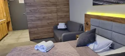 Łóżko lub łóżka w pokoju w obiekcie Aparthotel Apartamenty Czarna Góra 217